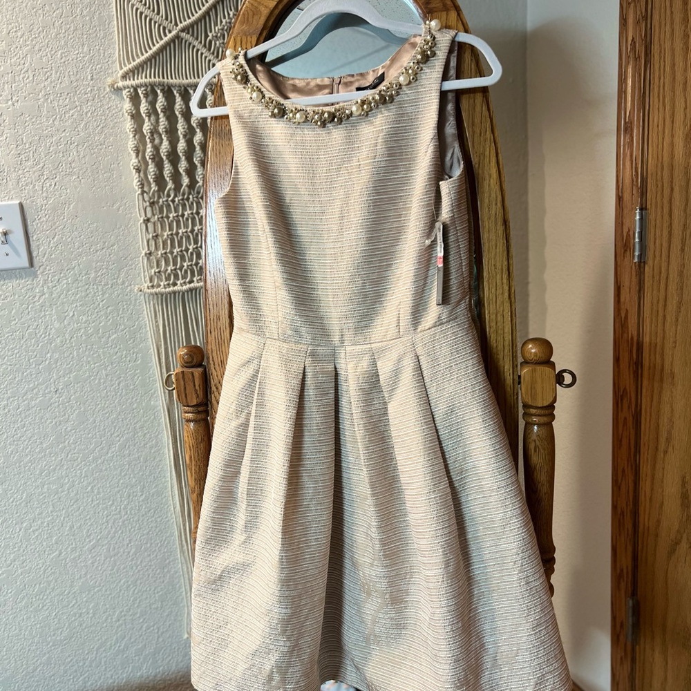 Elegant Cream Dress with Beaded Neckline